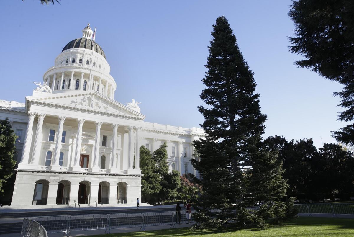 The state Capitol in Sacramento. A prominent lobbying firm was accused in a lawsuit of illegally funneling donations to state politicians. The accuser was fired by the firm in 2012.