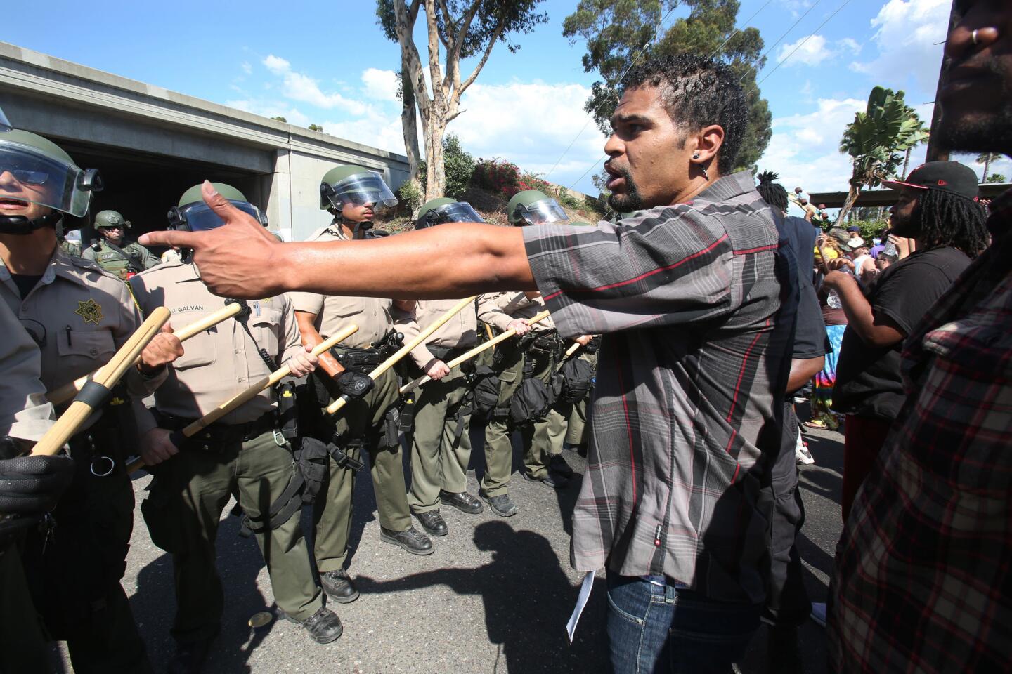 Protestors confront the police