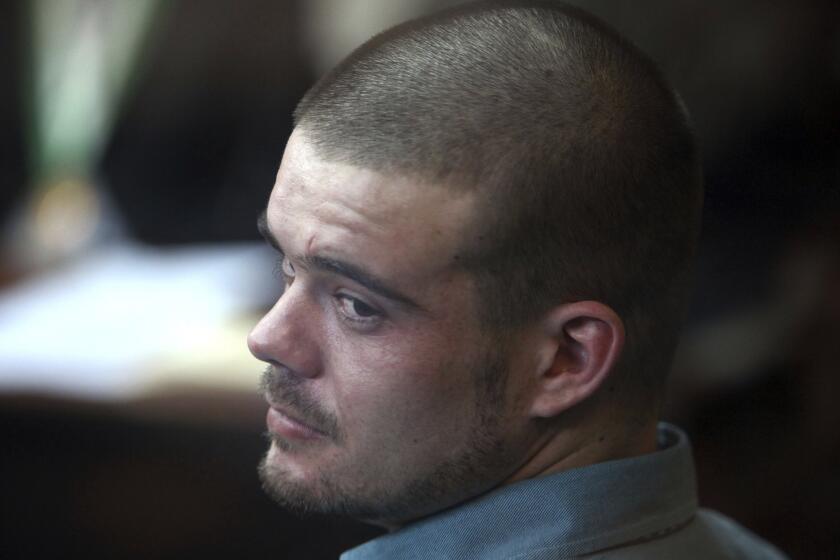 FILE - Joran van der Sloot looks back from his seat after entering the courtroom for the continuation of his murder trial at San Pedro prison in Lima, Peru, Jan. 11, 2012. The Peruvian government said on Monday, June 5, 2023 that Van der Sloot, the main suspect in the unsolved 2005 disappearance of American student Natalee Holloway, will be extradited this week to the United States. (AP Photo/Karel Navarro, File)