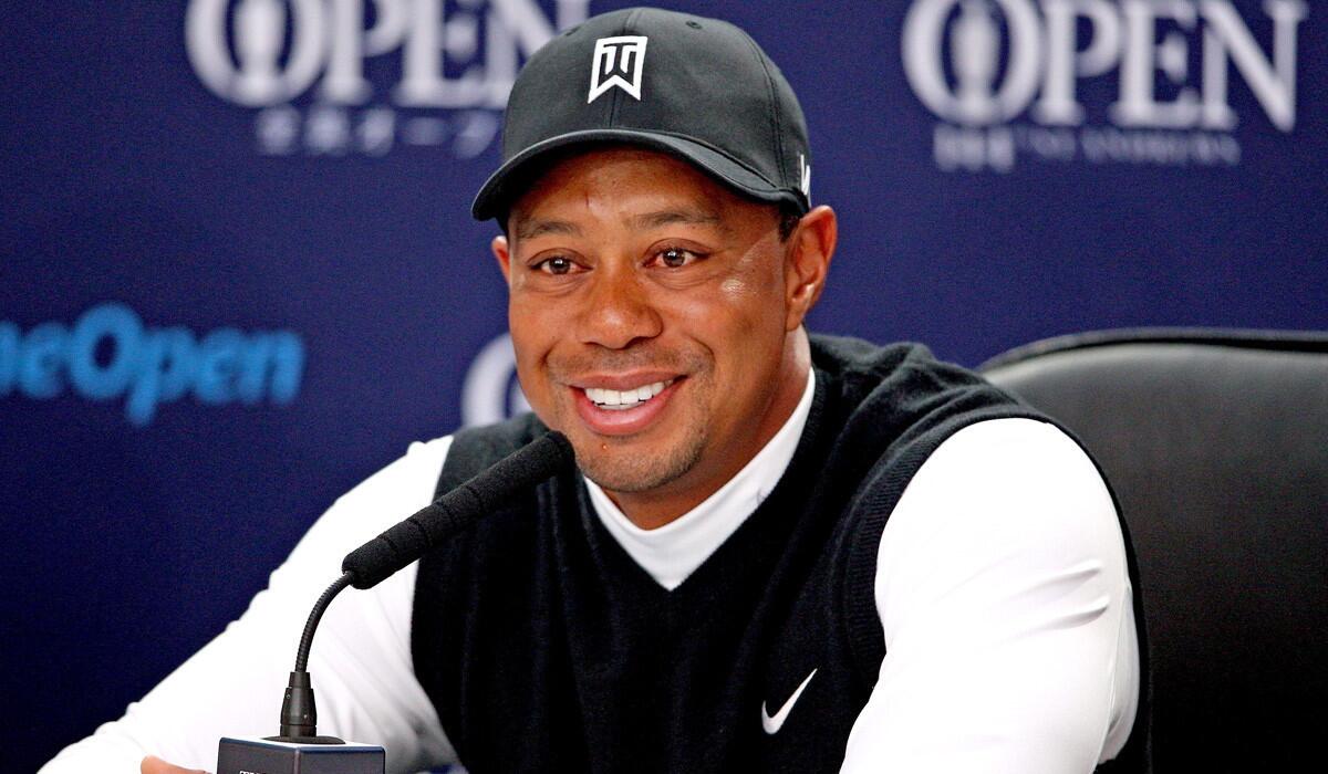 Tiger Woods talks to the media during a press conference on practice day of the 144th Open Golf Championship on Tuesday.