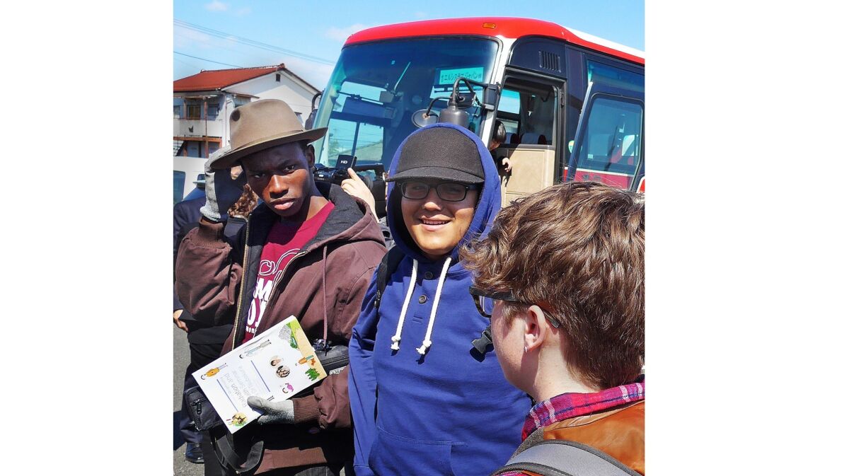 YOLA students arrive on bus from Fukushima to Soma, Japan. From left to right, Daniel Egwurube and Edson Nazarene.