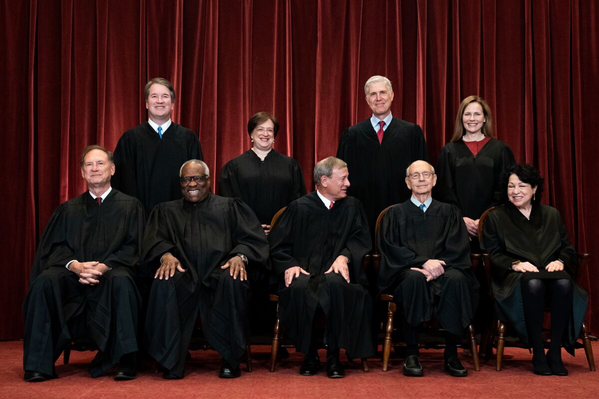 Members of the Supreme Court pose for a photo