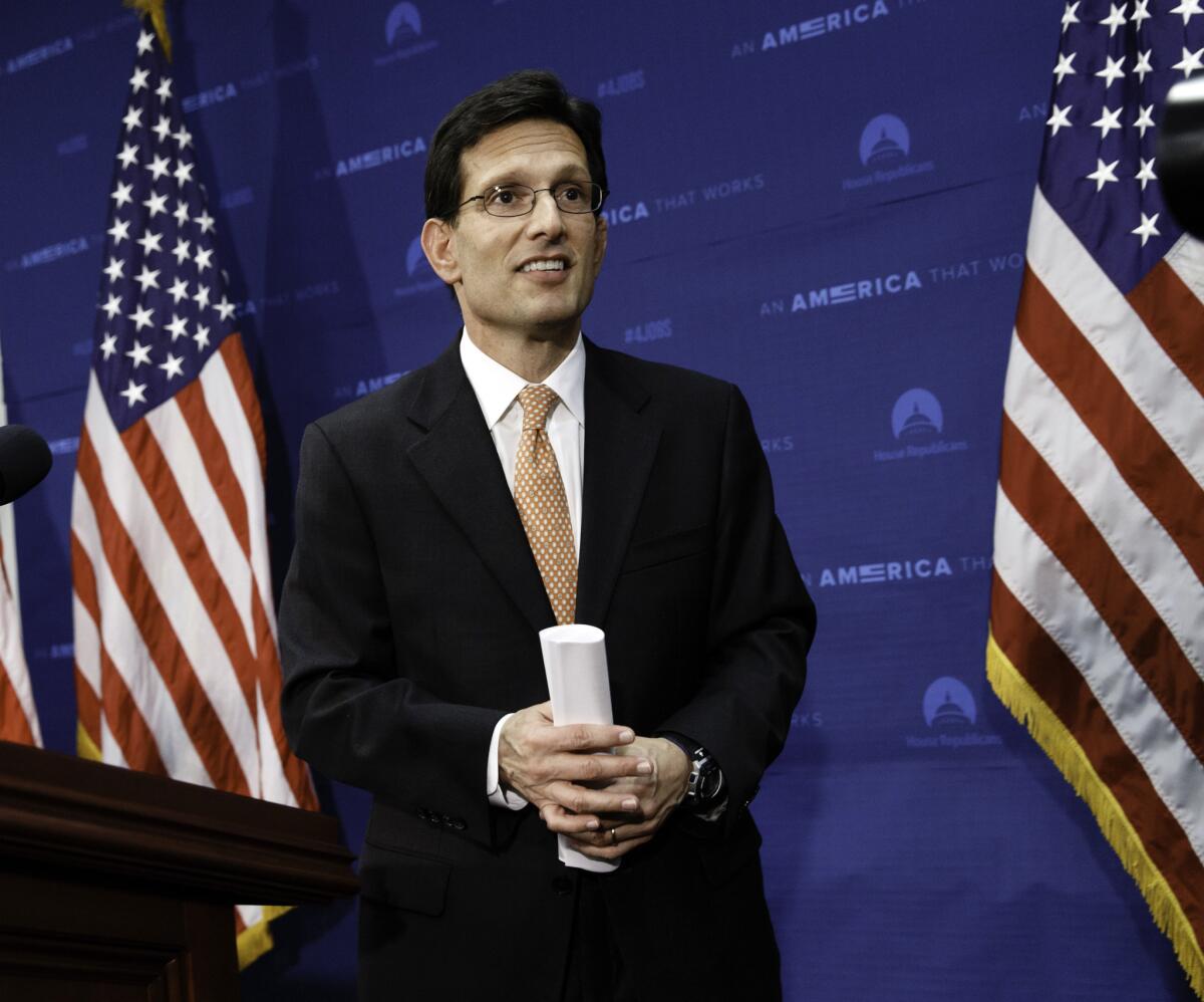 House Majority Leader Eric Cantor (R-Va.) leaves a news conference after telling reporters he intends to resign his leadership post at the end of July following his defeat in the Virginia primary Tuesday.