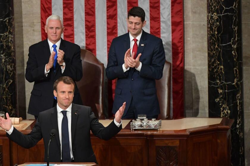 TOPSHOT - House Speaker Paul Ryan((R) and US Vice President Mike Pence applaud after France's President Emmanuel Macron addressed a joint meeting of Congress inside the House chamber on April 25, 2018 at the US Capitol in Washington, DC. / AFP PHOTO / MANDEL NGANMANDEL NGAN/AFP/Getty Images ** OUTS - ELSENT, FPG, CM - OUTS * NM, PH, VA if sourced by CT, LA or MoD **