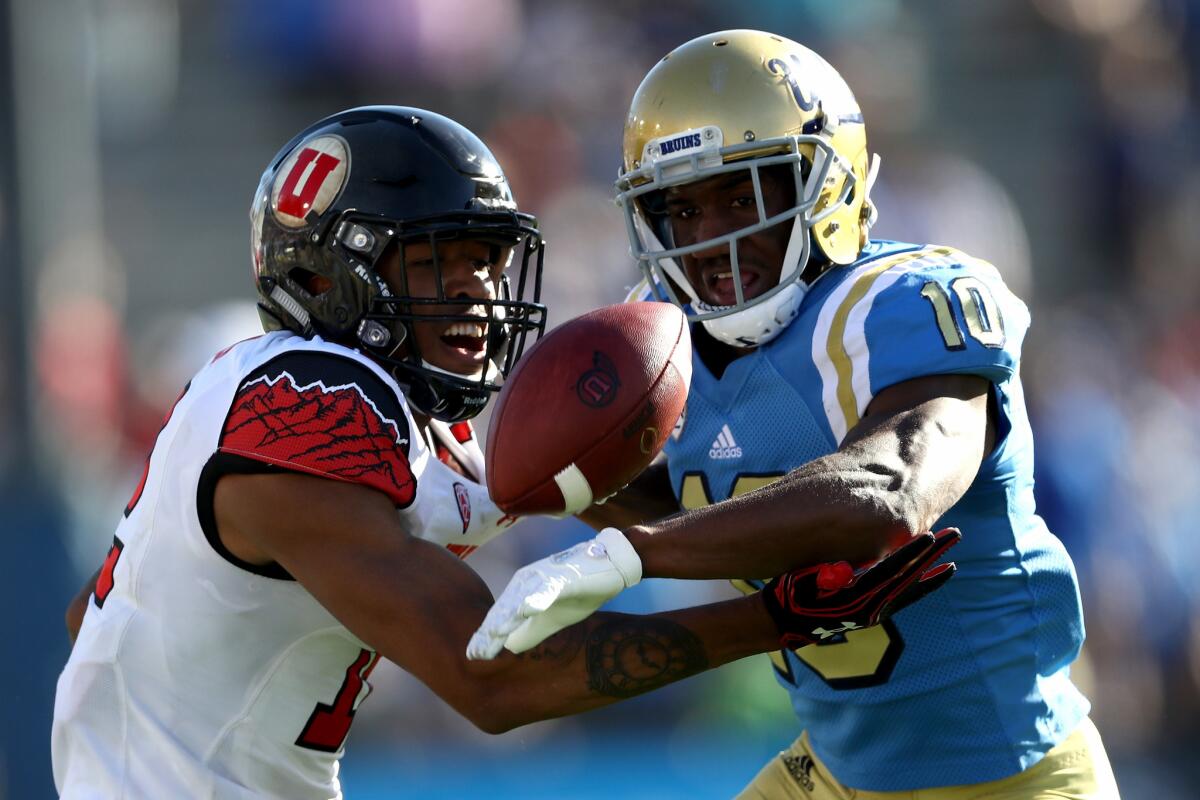 UCLA's Fabian Moreau, right, breaks up a pass intended for Utah's Tim Patrick on Oct. 22.