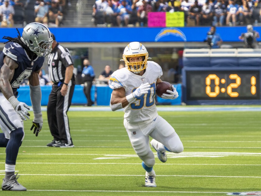 Chargers running back Austin Ekeler gains yardage against the Dallas Cowboys.