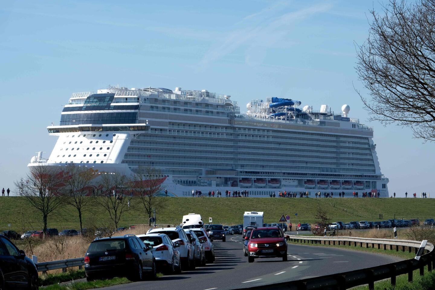 The "Norwegian Joy" cruise ship, previously named "Norwegian Bliss", makes its way over the river Ems near Emden, northern Germany, on March 27, 2017. The ship of the Norwegian Cruise Line, that was built at the Meyer Werft shipyard in Papenburg, northern Germany, is made ready to enter service. Final technical and nautical tests are due to be carried out during the following days on the North Sea. / AFP PHOTO / PATRIK STOLLARZPATRIK STOLLARZ/AFP/Getty Images ** OUTS - ELSENT, FPG, CM - OUTS * NM, PH, VA if sourced by CT, LA or MoD **