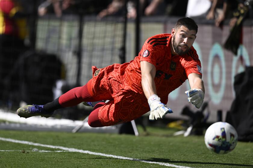 Los Angeles FC goalkeeper Maxime Crépeau (16) blocks a shot from Austin FC during the first half of an MLS playoff Western Conference final soccer match Sunday, Oct. 30, 2022, in Los Angeles. (AP Photo/John McCoy)