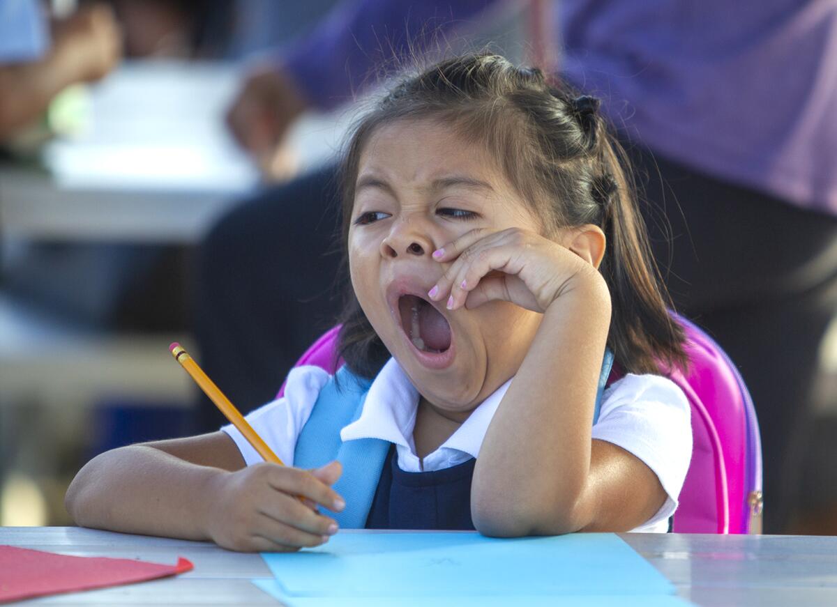 Lucia Reynoso, 5, yawns during the first day of school in 2019. 