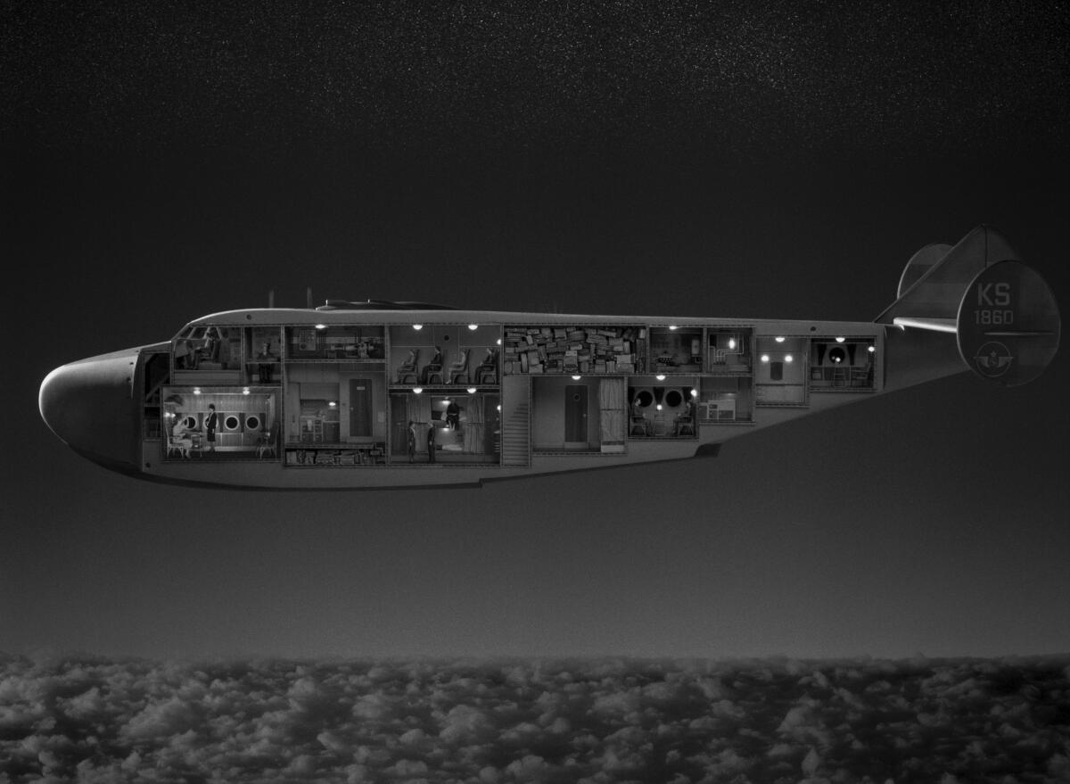 A cutaway of an airplane is seen in black and white.