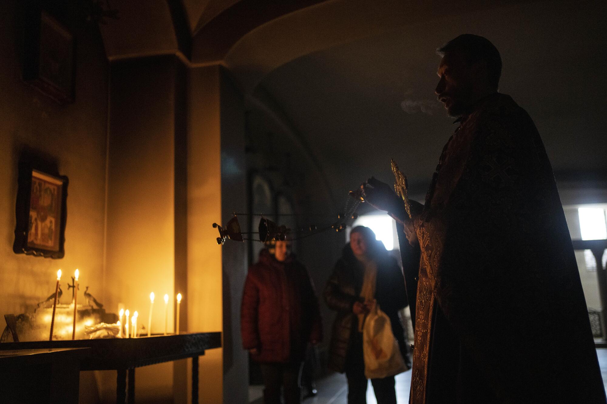 A priest delivers a Sunday service.