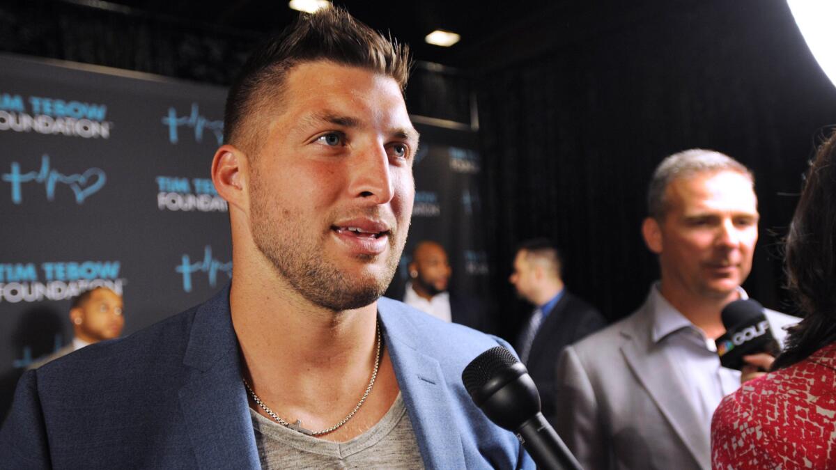 Former NFL quarterback Tim Tebow speaks to reporters at the Tim Tebow Foundation Celebrity Gala and Golf Classic in Ponte Vedra Beach, Fla., on March 13.