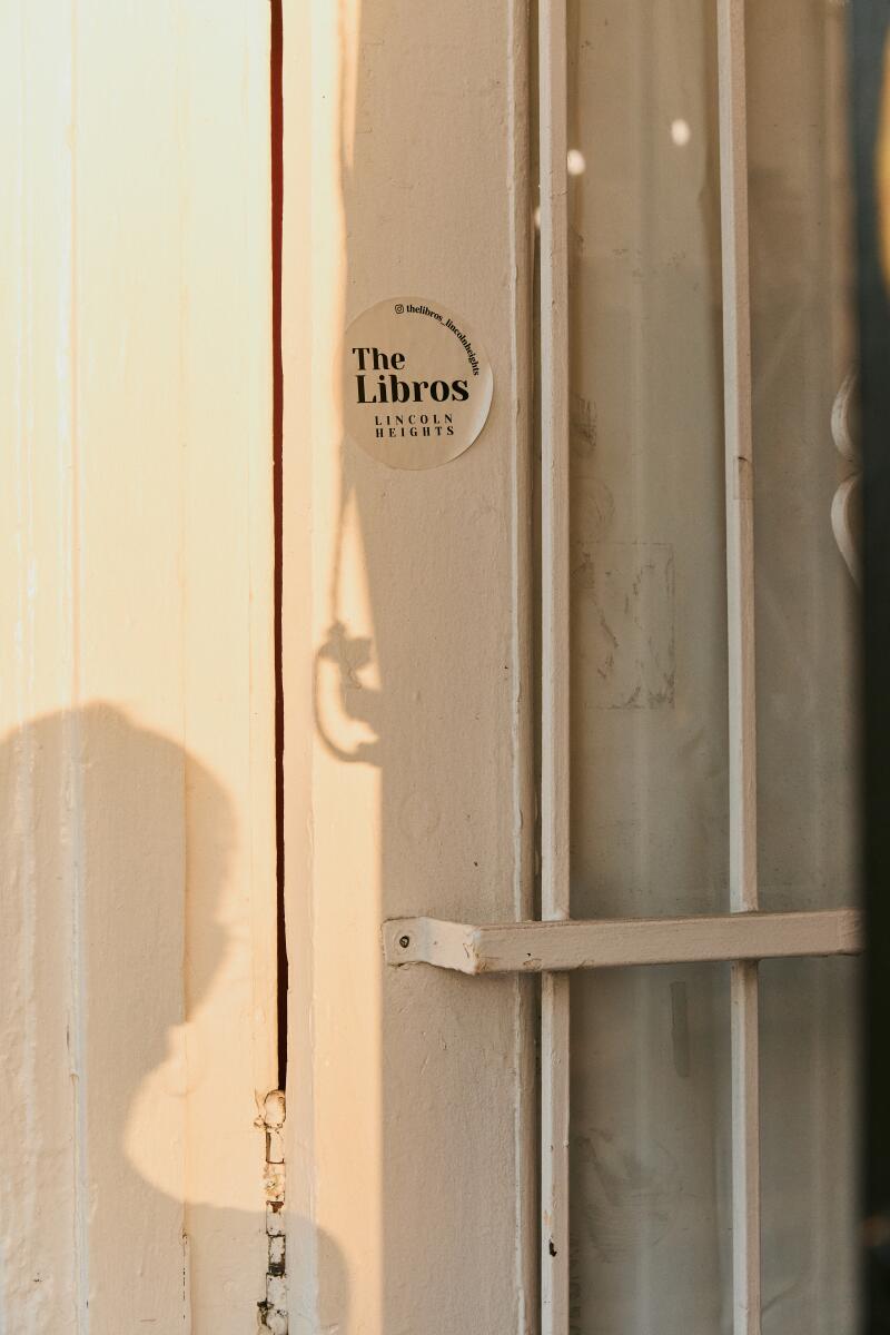 A sticker for the Libros on the doorway of the shop.