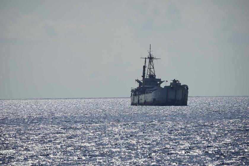 FILE - Philippine navy ship BRP Sierra Madre is seen at the Second Thomas Shoal, locally known as Ayungin Shoal, at the South China Sea, April 23, 2023. A Chinese vessel and a Philippine supply ship collided near the disputed Spratly Islands in the South China Sea on Monday, June 17, 2024, China's coast guard said.(AP Photo/Aaron Favila)