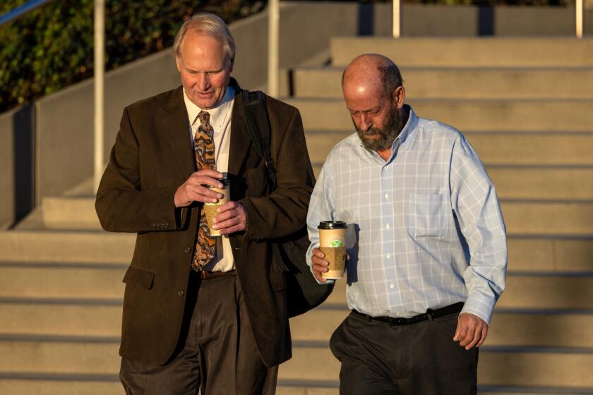 LOS ANGELES, CA - NOVEMBER 03: Defendant Jerry Boylan, right, captain of the Conception dive boat, arrives at Federal Court on Friday, Nov. 3, 2023 in Los Angeles, CA. (Irfan Khan / Los Angeles Times)