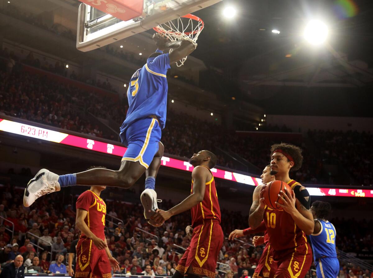 UCLA's Adem Bona dunks during the second half against USC on Saturday.