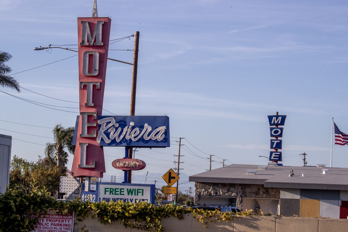Neon signs advertise the old Riviera Motel and Tahiti Motel in Stanton.