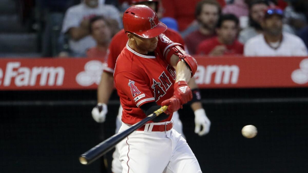 Angels' Andrelton Simmons hits a solo home run against the New York Yankees during the first inning on April 24 at Angel Stadium.