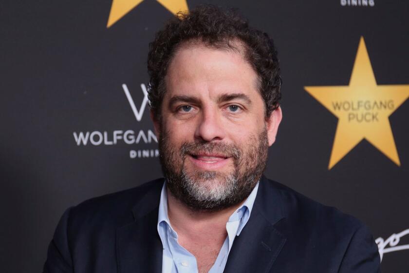 FILE - In this April 26, 2017 file photo, Brett Ratner arrives at the Wolfgang Puck's Post-Hollywood Walk of Fame Star Ceremony Celebration in Beverly Hills, Calif. Hollywood's widening sexual harassment crisis ensnared another prominent film director when six women, Including actress Olivia Munn, accused Ratner of harassment or misconduct in a Los Angeles Times report, on Wednesday, Nov. 1. (Photo by Willy Sanjuan/Invision/AP, File)