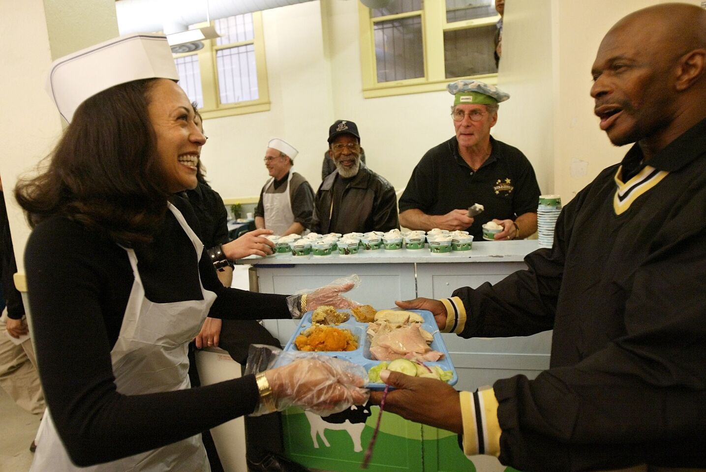 Nov. 27, 2003: San Francisco district attorney candidate Kamala Harris serves lunch while volunteering at Thanksgiving service.