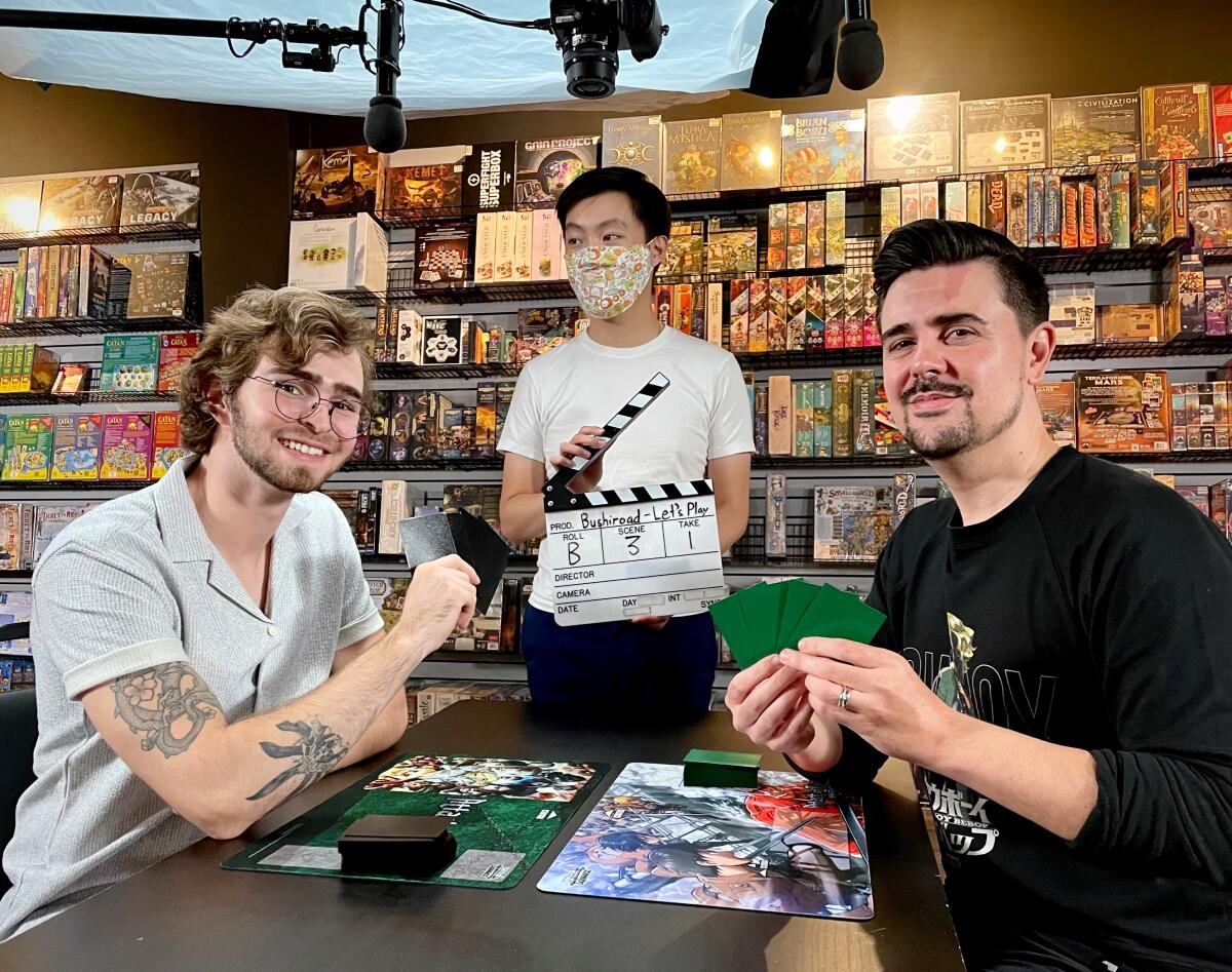 Pokémon enthusiast Alex Hodges, right, in 2022 on the set of a video production with Alan Ayala for IGN.com.