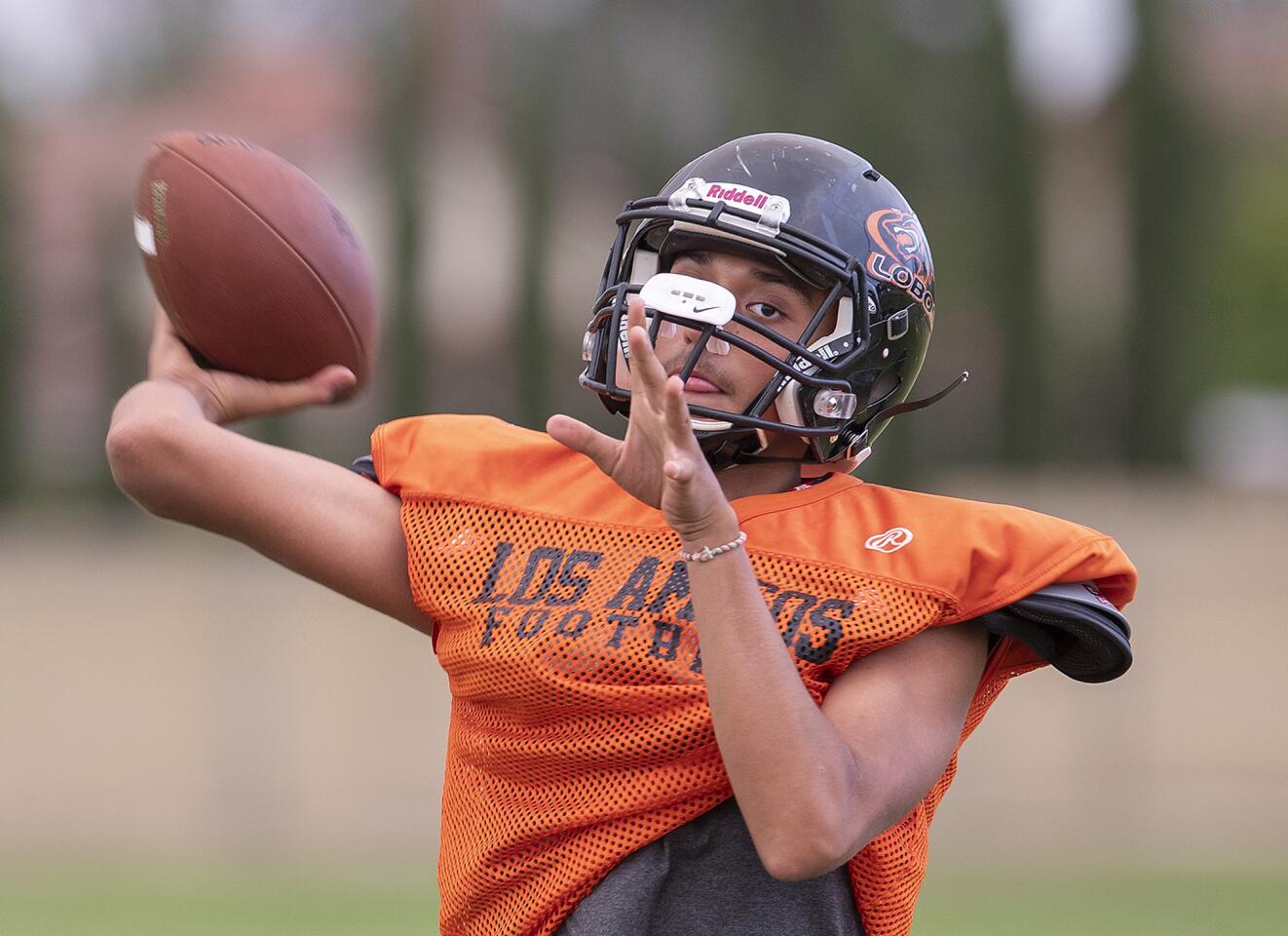Los Amigos's Brandon Tinoco throws during practice on Friday, August 10.
