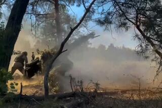 In this photo taken from video released by the Russian Defense Ministry on Friday, July 12, 2024, Russian soldiers fire from their howitzer from their position at Ukrainian troops at an undisclosed location in Ukraine. (Russian Defense Ministry Press Service via AP)