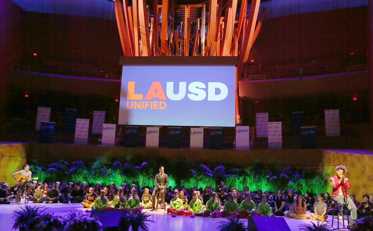 Los Angeles Unified Supt. Alberto M. Carvalho joins student performers on stage