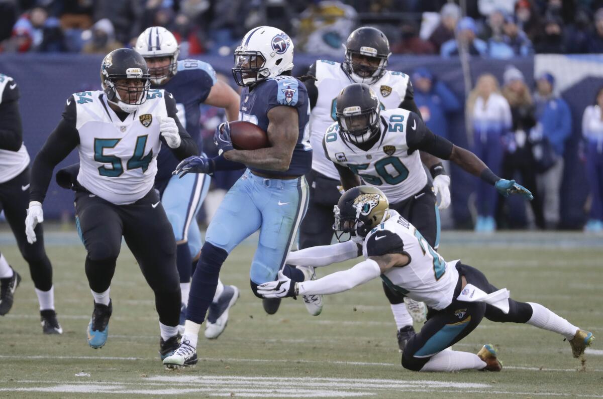 FILE - In this Dec. 31, 2017, file photo, Tennessee Titans running back Derrick Henry (22) gets past Jacksonville Jaguars defenders Eli Ankou (54), Telvin Smith (50) and A.J. Bouye (21) as Henry scores a touchdown on a 66-yard pass play in the first half of an NFL football game in Nashville, Tenn. The Jaguars (10-6) have allowed nine scoring plays of 25 or more yards _ and several more that led to points _ in the last six games.