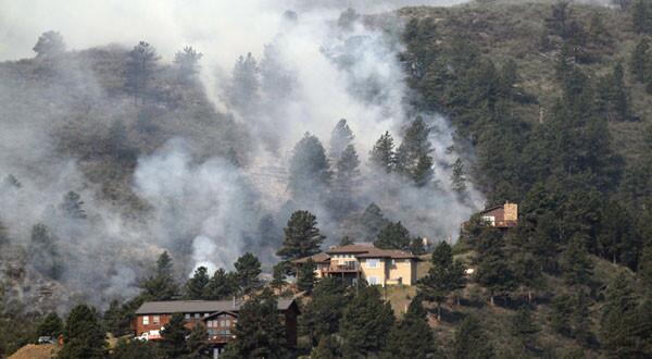 Colorado's High Park fire looms behind homes
