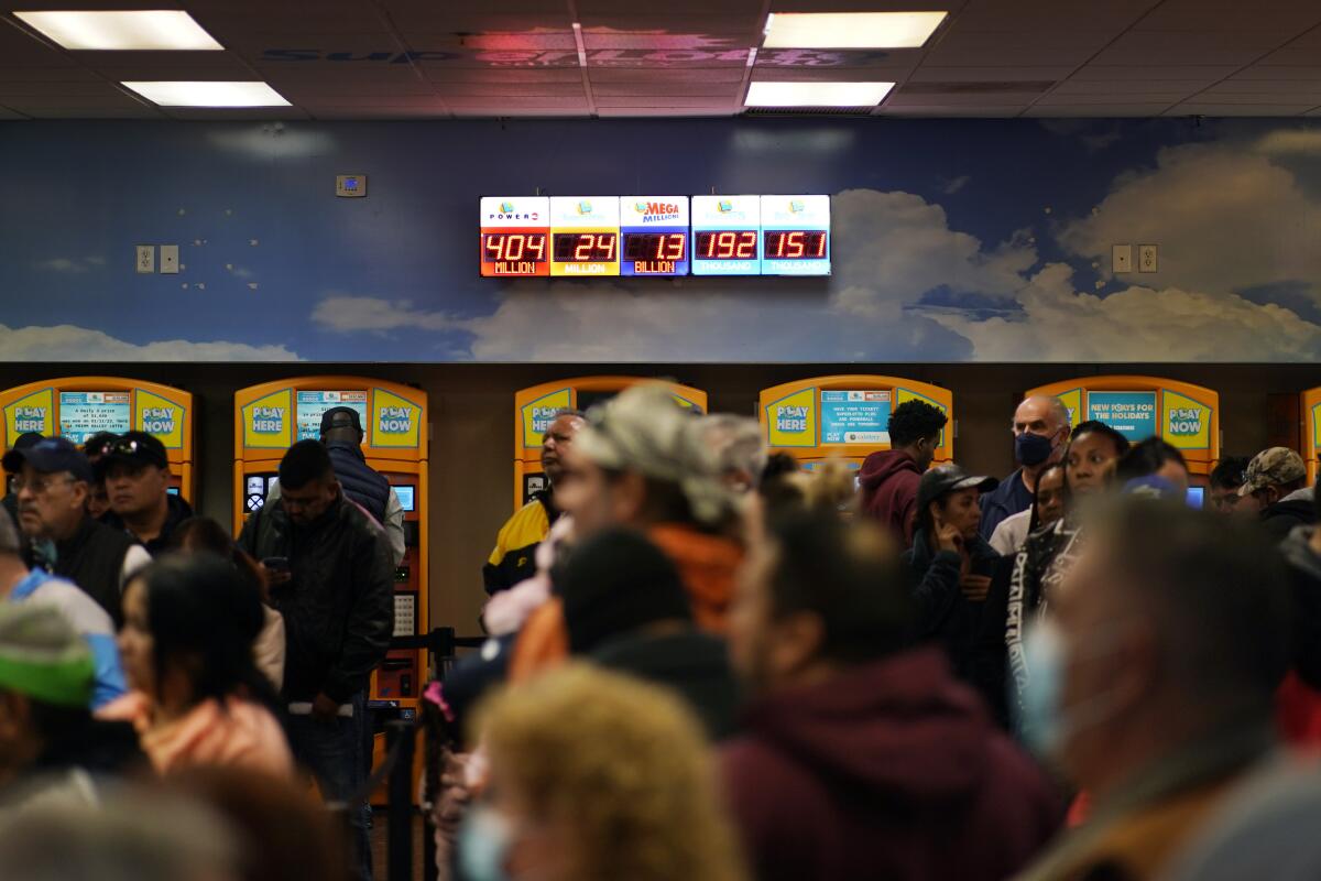 People wait in line at the Lotto Store 