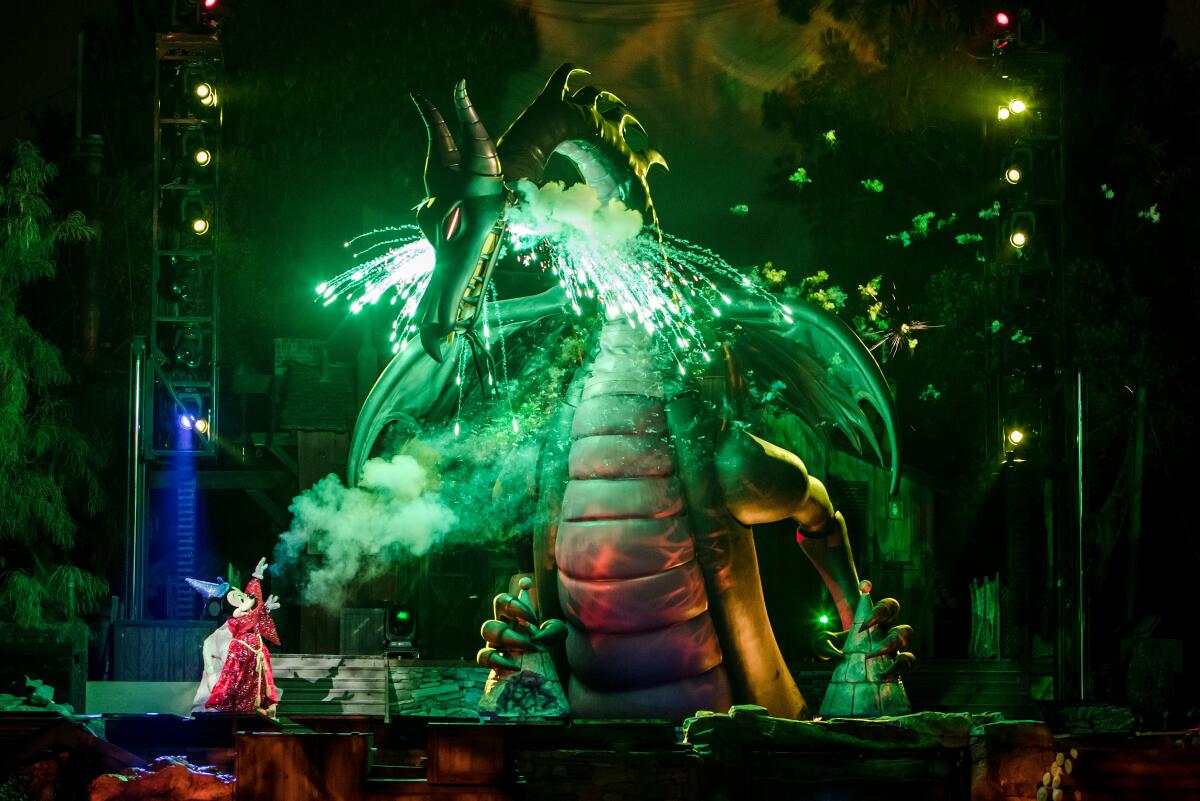 A green dragon on stage