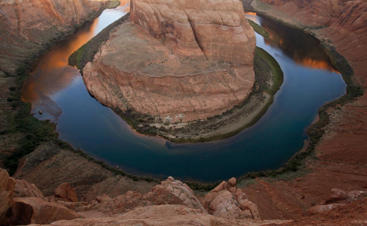 PAGE, AZ., AUGUST 30, 2013: Located five-miles from the Glen Canyon Dam and Lake Powell, the Colorado River makes a 270-degree curve at Horse Shoe Bend near Page, Arizona just after sunrise August 30, 2013(Mark Boster/Los Angeles Times).