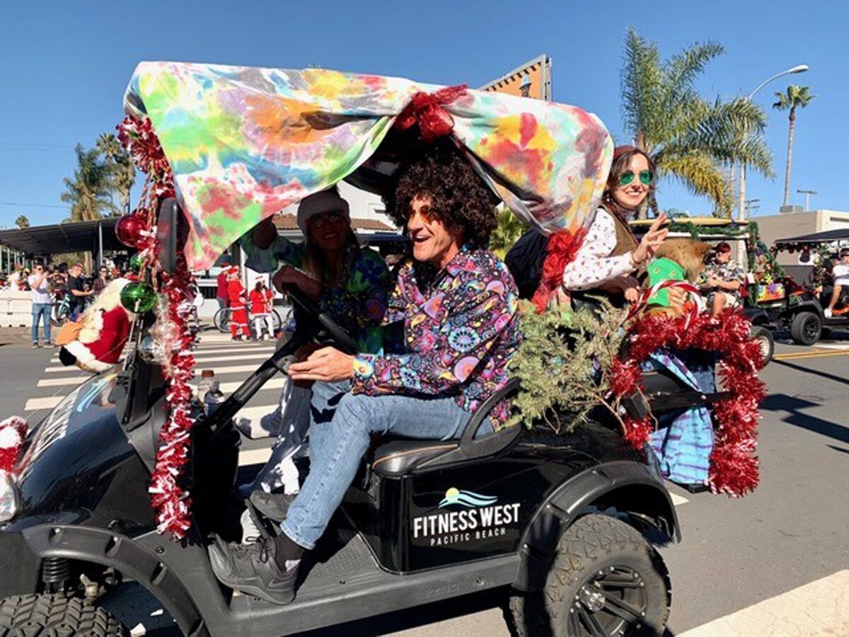 Brian J. Curry with his family participating in the annual Pacific Beach Holiday Parade.