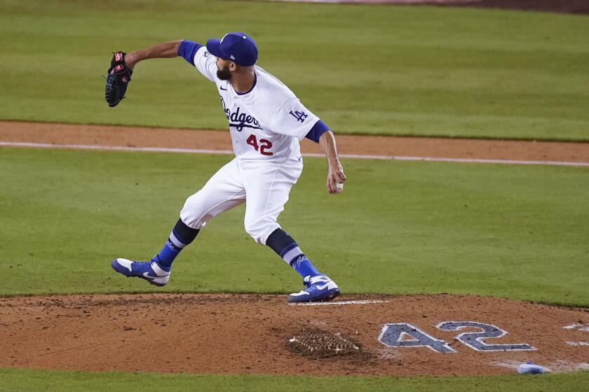 Los Angeles Dodgers relief pitcher David Price throws during the ninth inning of a baseball game against the Colorado Rockies Thursday, April 15, 2021, in Los Angeles. All players wore jersey number 42 to honor Jackie Robinson, the first African American to play in Major League Baseball. (AP Photo/Ashley Landis)