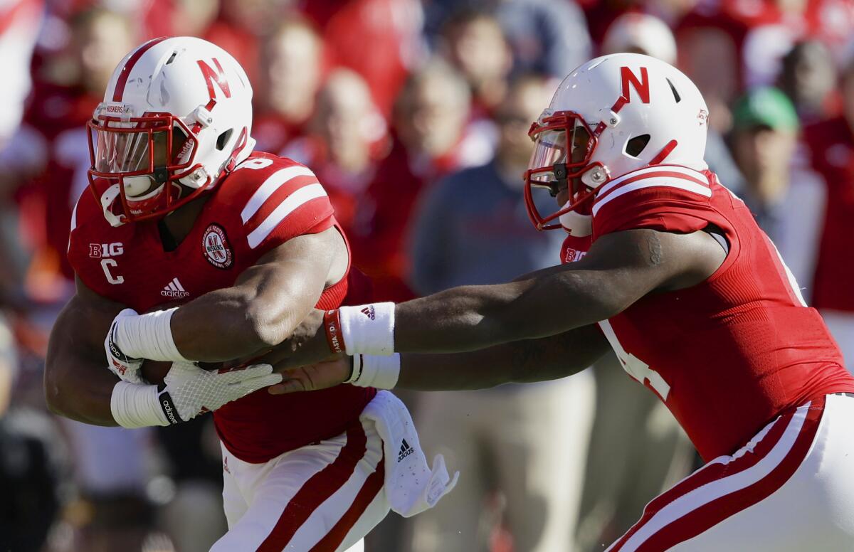 Tommy Armstrong Jr., right, and Ameer Abdullah lead a Nebraska offense that averages 446.3 yards and 37.4 points per game.