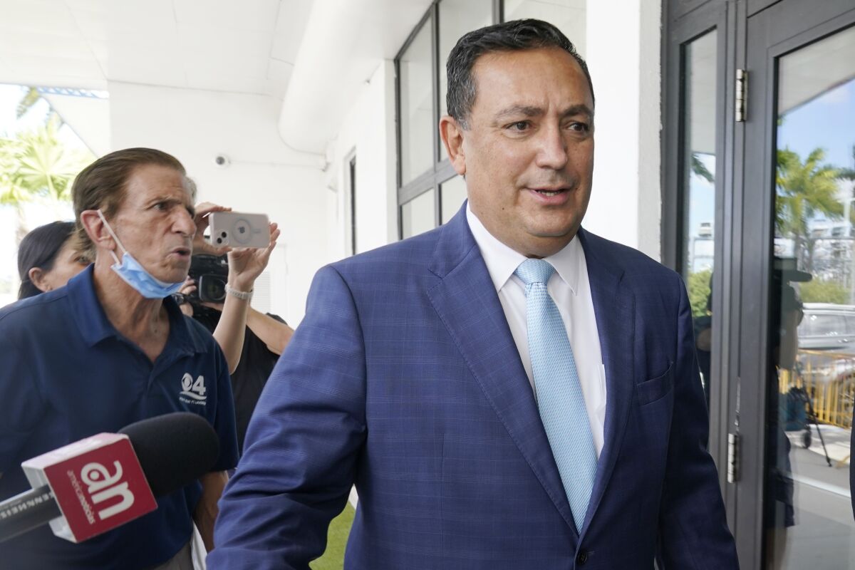 Miami police Chief Art Acevedo arrives at Miami City Hall for a hearing to determine his job, Thursday, Oct. 14, 2021, in Miami. Acevedo was suspended after a tumultuous six-month tenure. (AP Photo/Marta Lavandier)