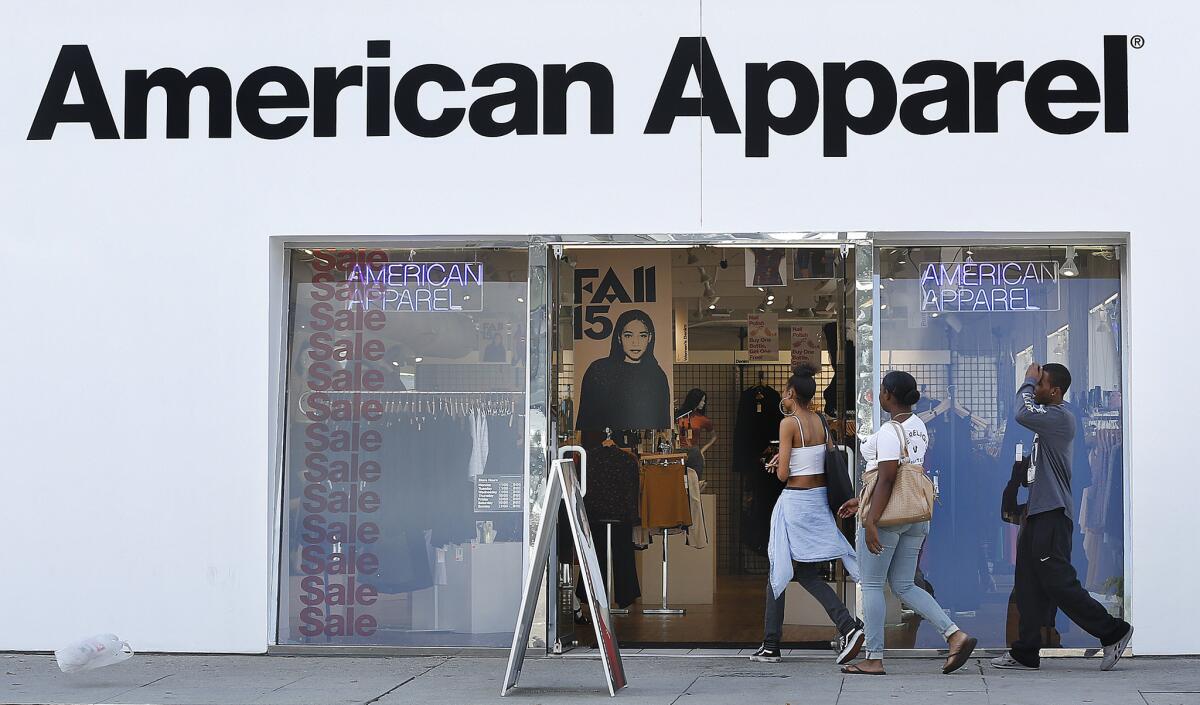 Customers make their way into an American Apparel store on Melrose Avenue in Los Angeles in October 2015.