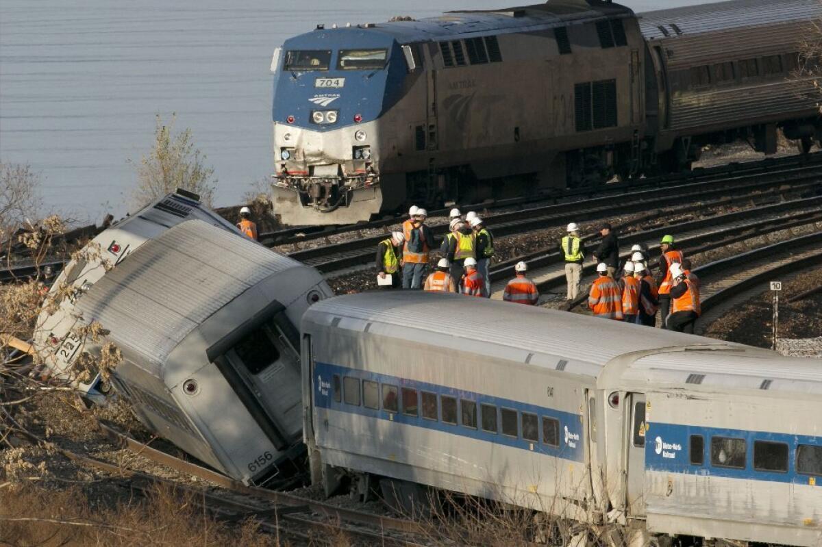 An Amtrak train rounds a curve near the site of a Metro-North Railroad derailment on Dec. 1, 2013, which killed four passengers. The National Transportation Safety Board says the engineer of the derailed train suffered from "severe" sleep apnea.