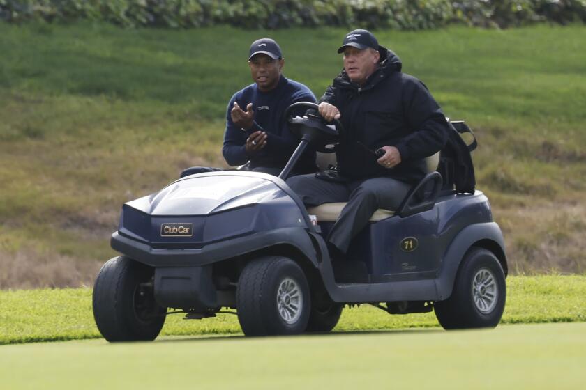 Pacific Palisade, CA - February 16: Tiger Woods is driven off the course after withdrawing.