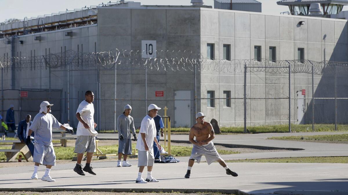 Inmates exercise in the yard at Solano State Prison in March 2017.