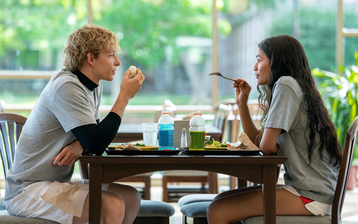 A man and a woman have lunch together.