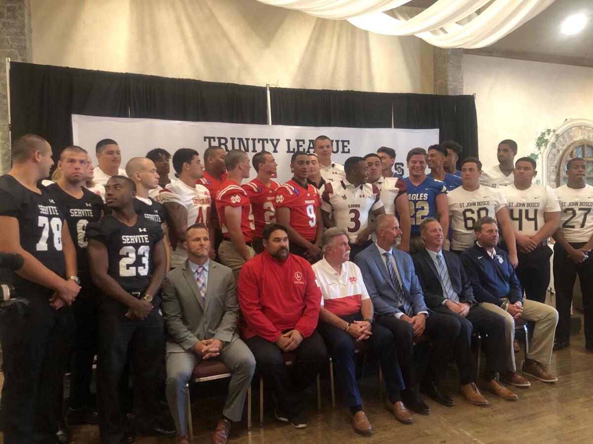 Players and coaches gather Friday for the first Trinity League football media day.