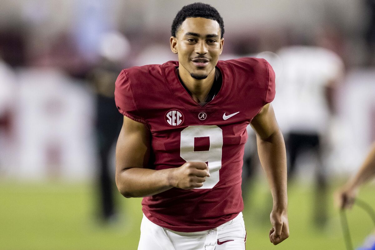 Alabama quarterback Bryce Young jogs off the field after a win against Southern Mississippi on Sept. 25, 2021.