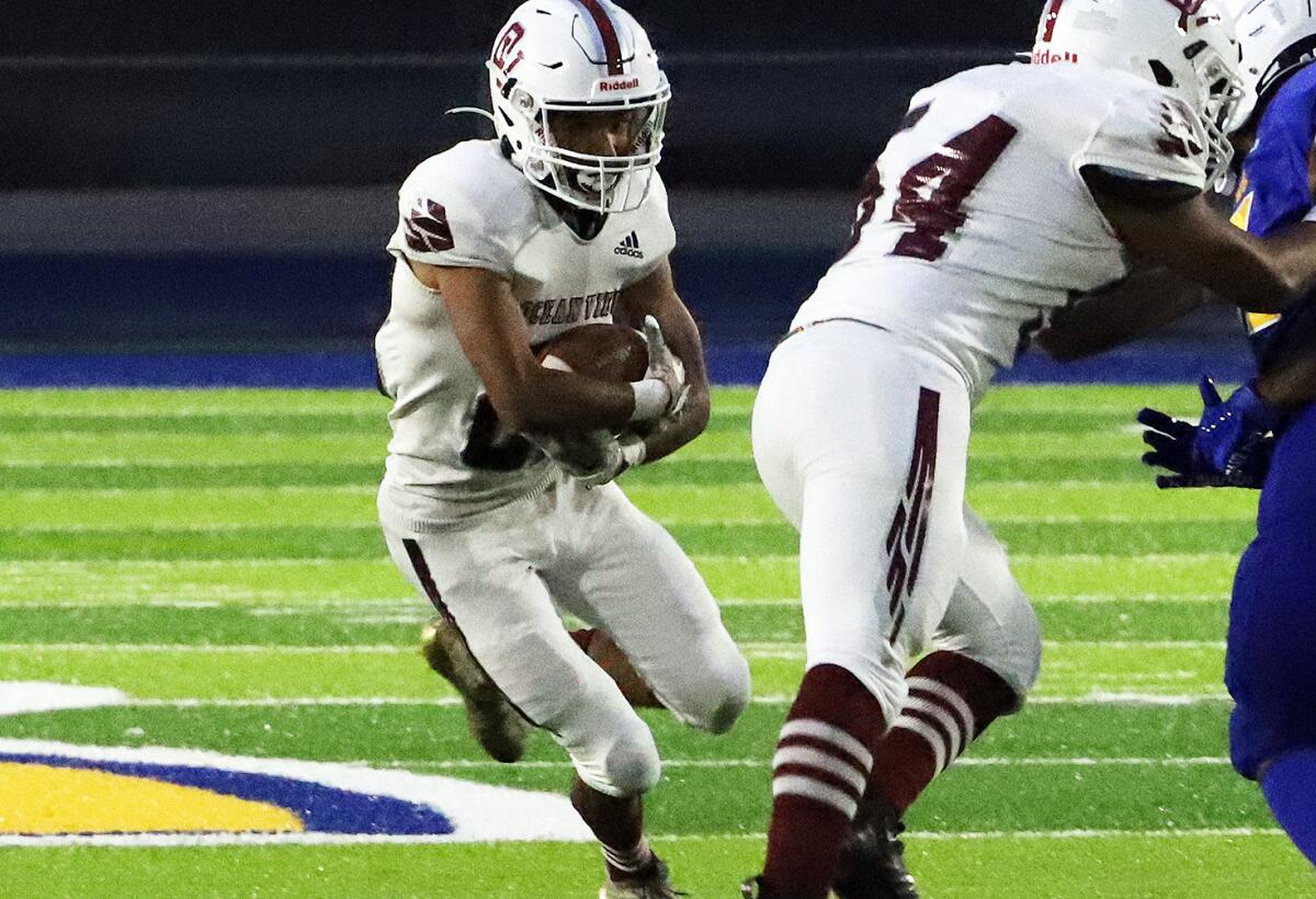 Ocean View's Angel Adame (22) tries to run through Gahr's defense on Friday.