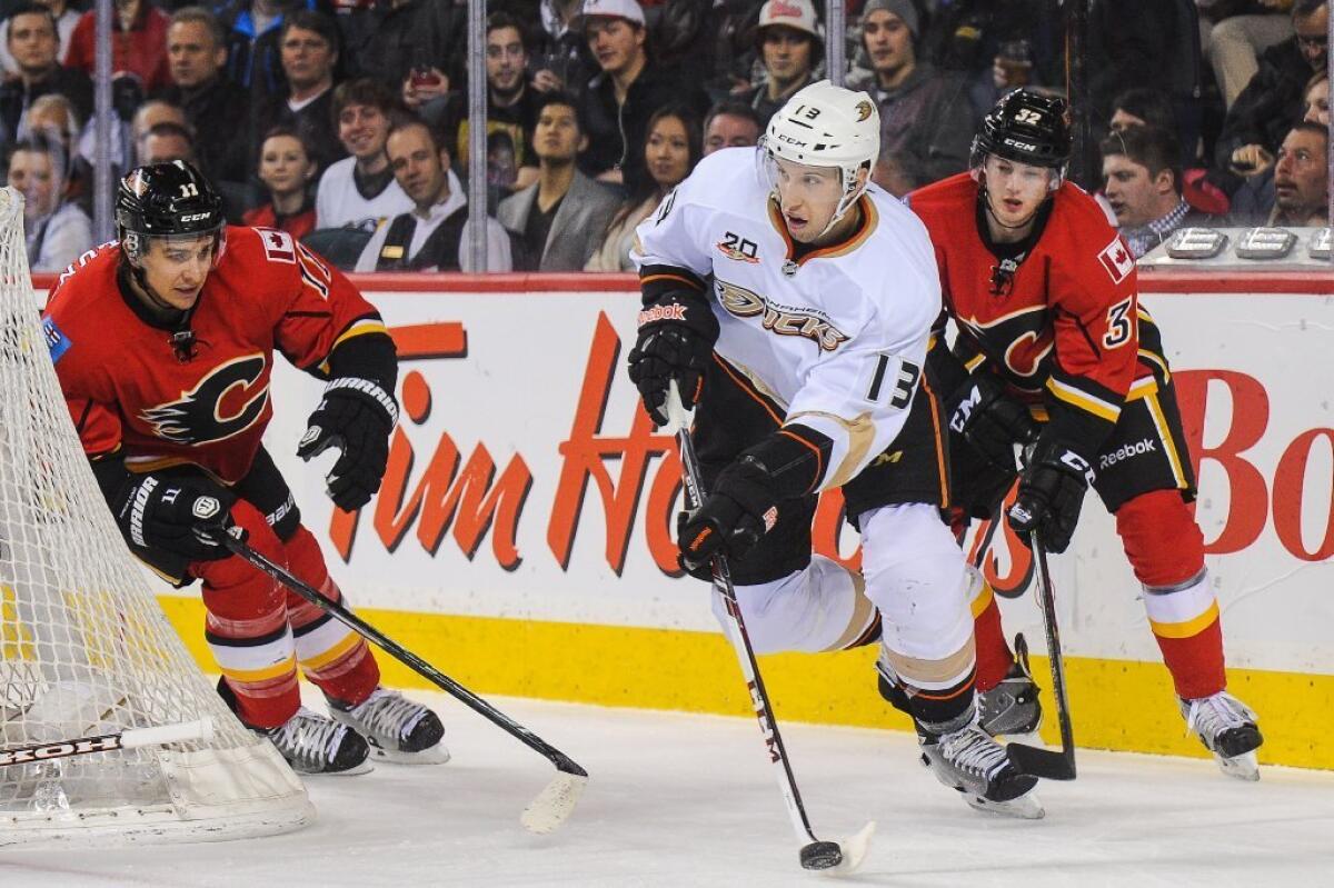 Nick Bonino skates with the puck.