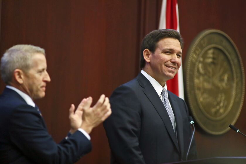 House Speaker Paul Renner, R-Palm Coast, left, applauds as Florida Gov. Ron DeSantis gives his State of the State address during a joint session of the Senate and House of Representatives Tuesday, March 7, 2023, at the Capitol in Tallahassee, Fla. (AP Photo/Phil Sears)