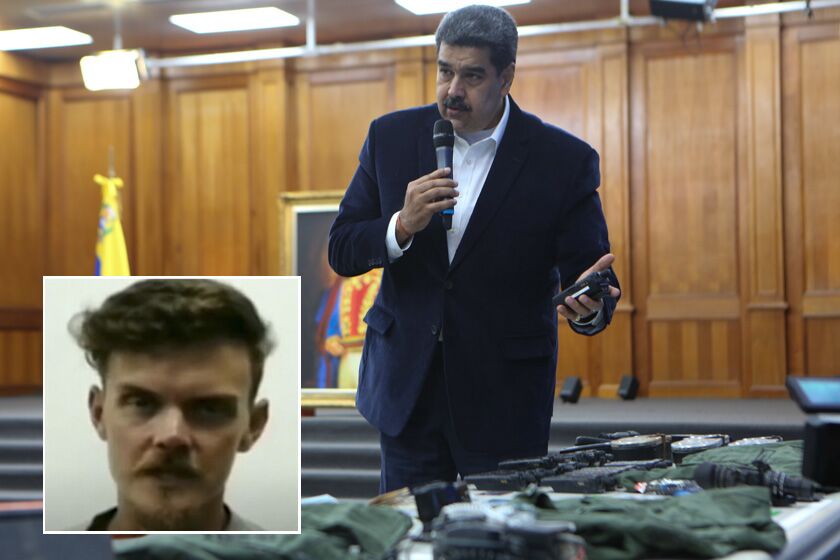 This photo released by the Venezuelan Miraflores presidential press office shows President Nicolas Maduro speaking over military equipment that he says was seized during an incursion into Venezuela, during his televised address from Miraflores in Caracas, Venezuela, Monday, May 4, 2020. Maduro said authorities arrested two U.S. citizens among a group of mercenaries on Monday, a day after a beach raid purportedly aimed at capturing the leader that Venezuelan authorities say they foiled. (Miraflores press office via AP)