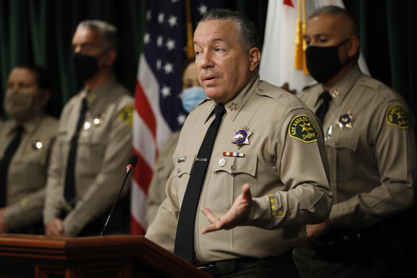 LOS ANGELES, CA - MAY 26: Los Angeles County Sheriff Alex Villanueva discusses organizational change, transparency, accountability and how they relate to the issue of deputy cliques during a press conference at the Hall of Justice Wednesday May 26, 2021. The Sheriff also addressed a damages claim filed by the city of Compton against Los Angeles County today, alleging the sheriff's department has bilked the city out of millions of dollars by falsely reporting the amount of time deputies spend patrolling the city. Sheriff Alex Villanueva dismissed the allegations. "We have about 45 contracts and we measure the minutes, and there's a rate -- we have to get close to 100%, either slightly above or slightly below,'' Villanueva said. "If we're missing that target, I don't think it's going to be the grand conspiracy that the outgoing mayor of Compton wants it to be. "But we'll definitely take the allegation seriously, and we are already doing a thorough audit on it, and we'll take action based on the results of that. Nothing unusual there. But to call it a fraud, that might be a little bit of a stretch.'' Hall of Justice on Wednesday, May 26, 2021 in Los Angeles, CA. (Al Seib / Los Angeles Times).