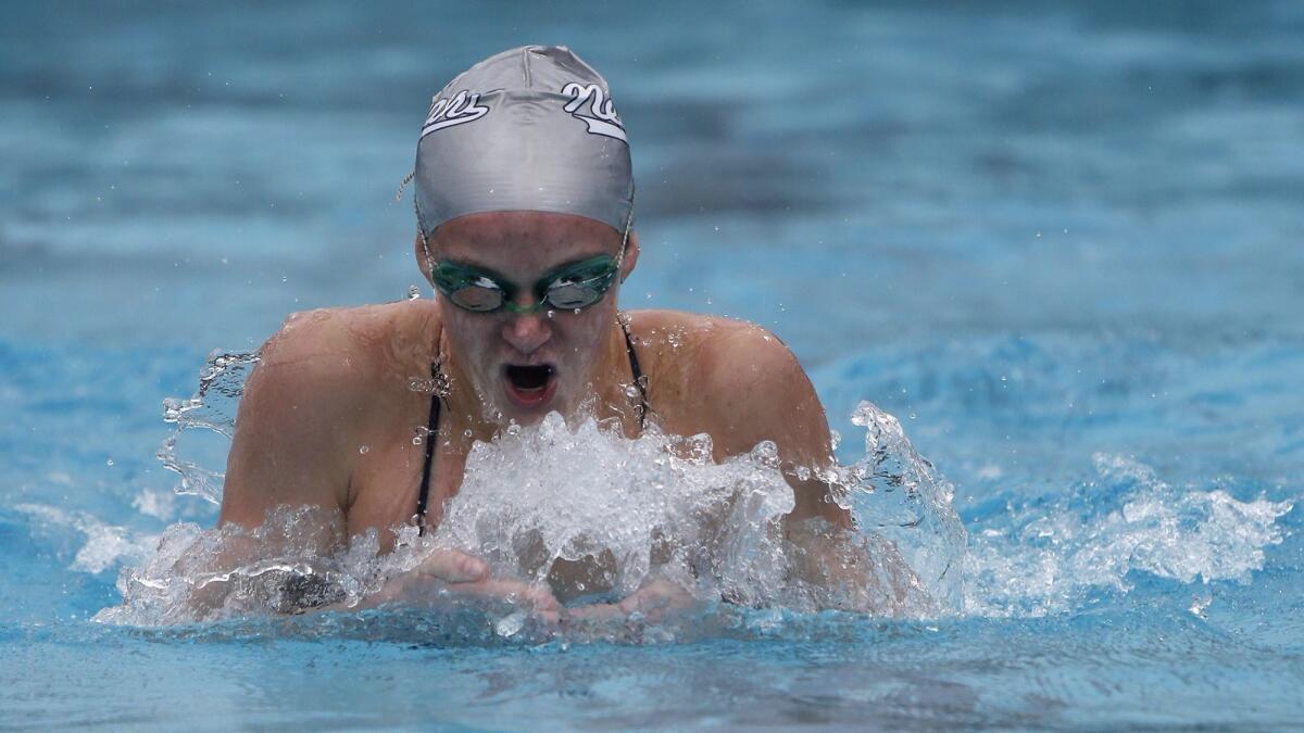 Ayla Spitz, shown competing on March 10, is open to swimming whatever event her Newport Harbor High swimming team needs her in.